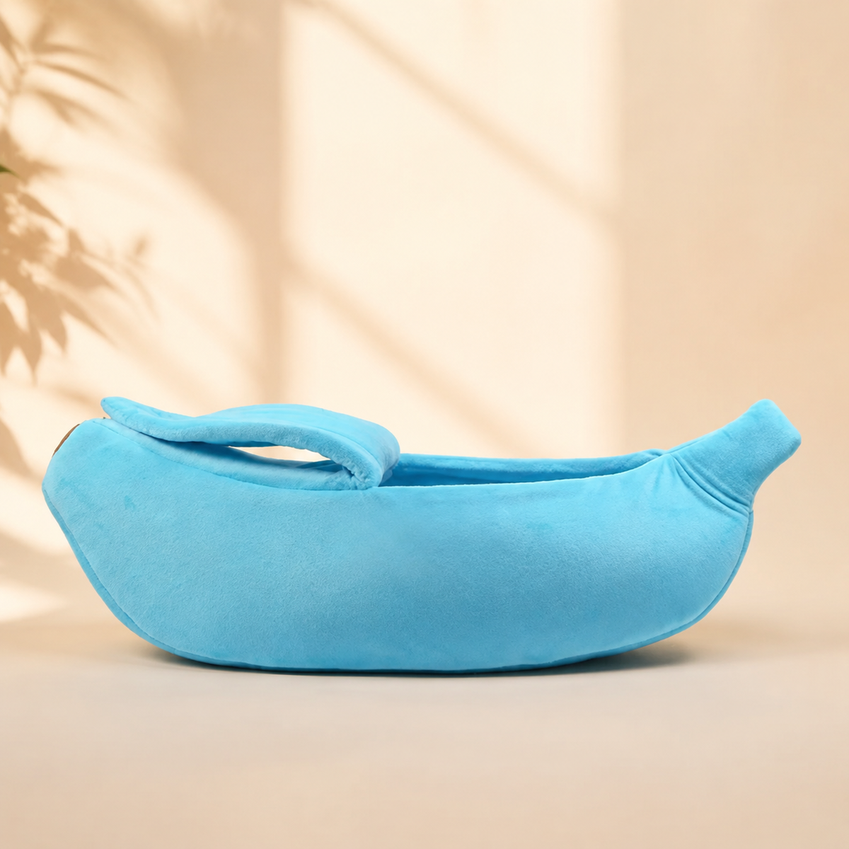 Blue banana-shaped pet bed