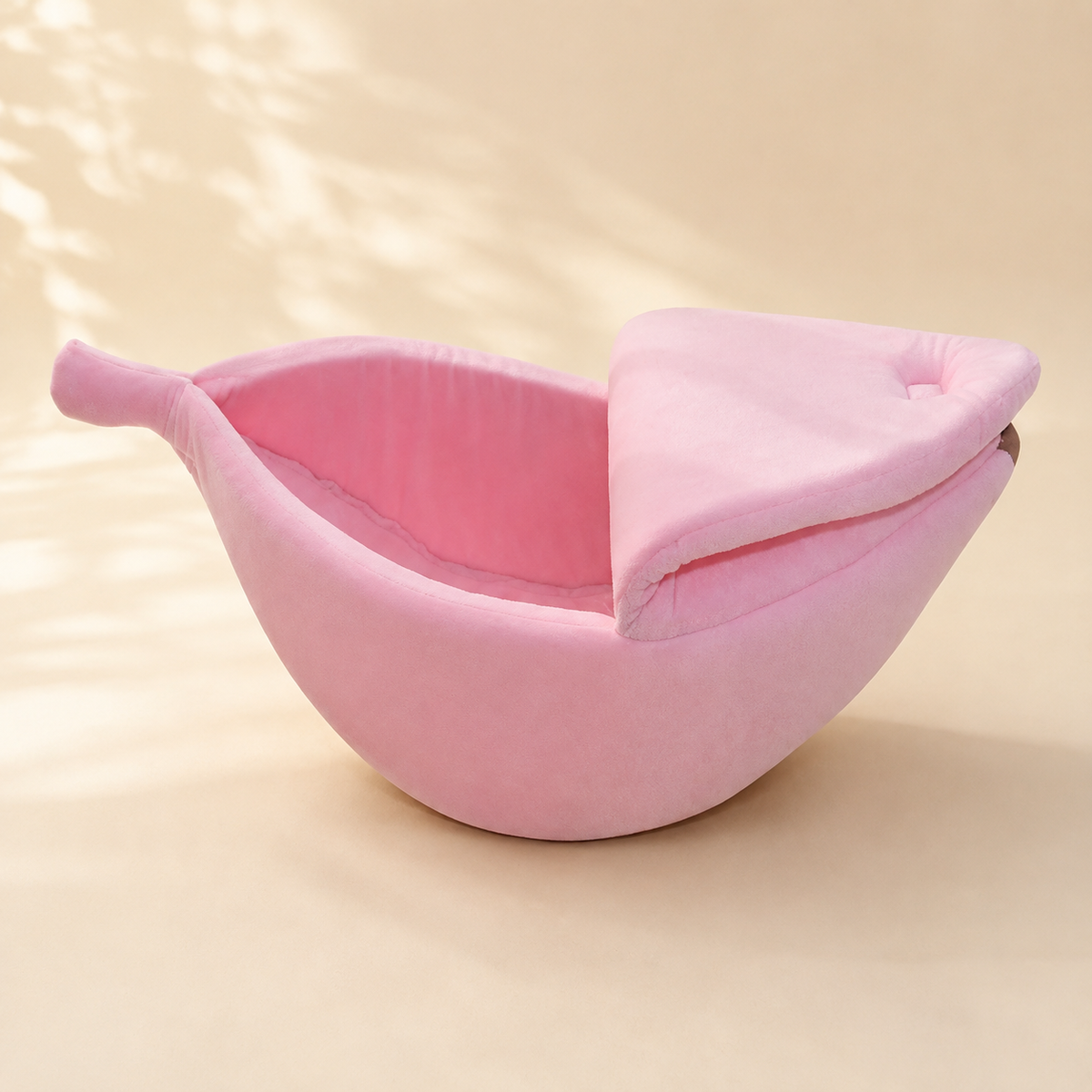 Pink banana-shaped pet bed