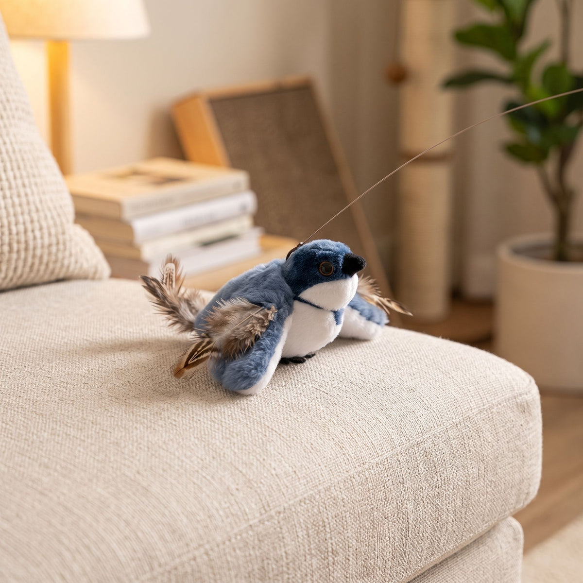 Macro shot of petite flapping bird toy on sofa cushion, warm indoor lighting highlighting textured material.