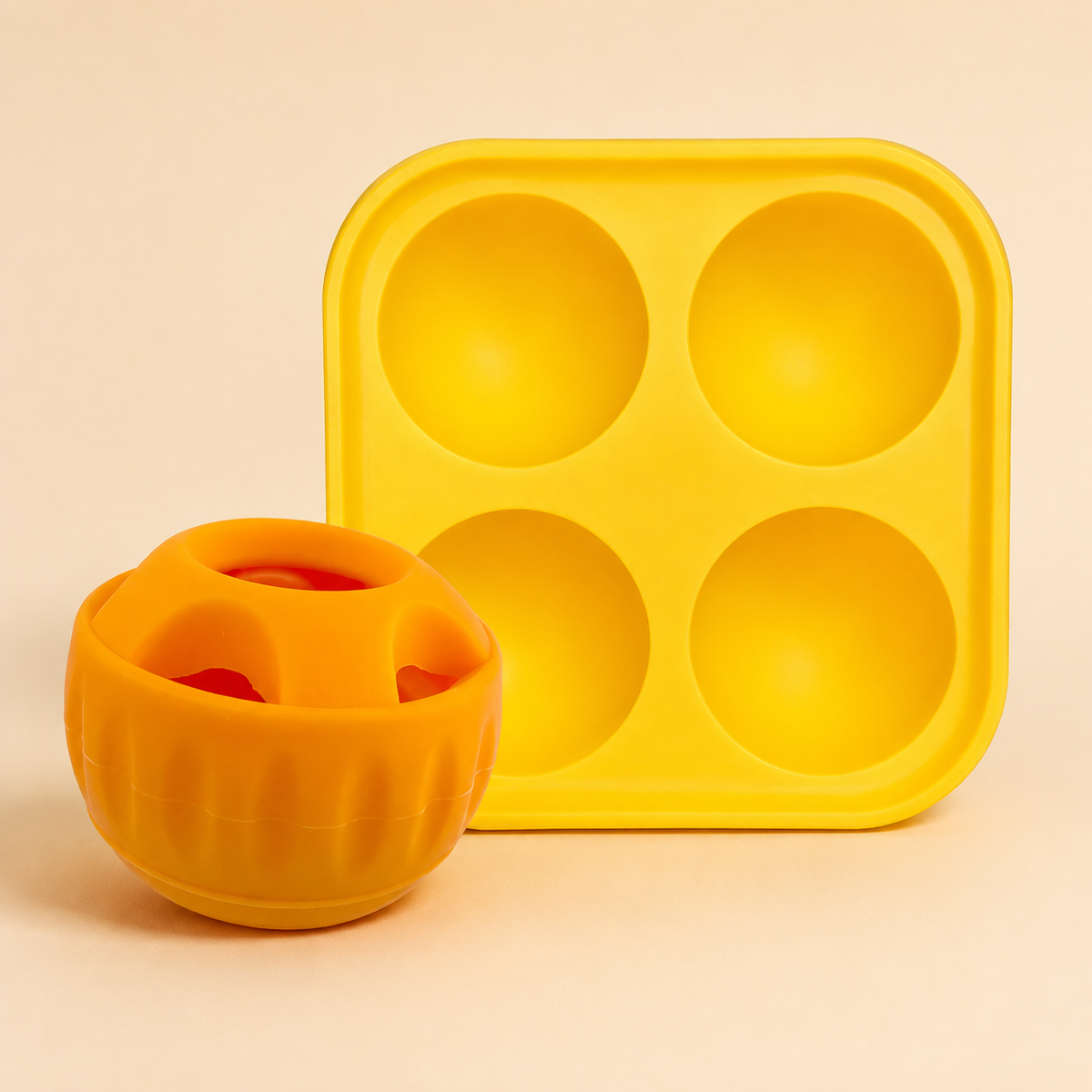 Orange slow feeder ball with yellow feeding tray